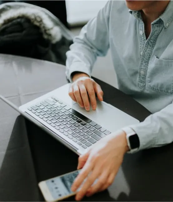 A laptop placed on a person's lap.
